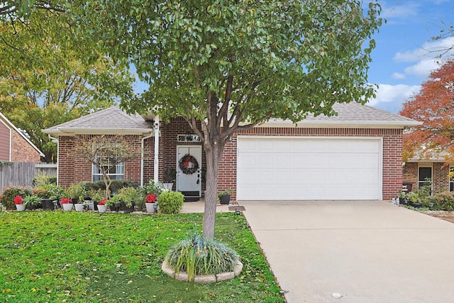 view of front of home with a garage and a front yard