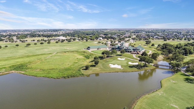 birds eye view of property with a water view and golf course view