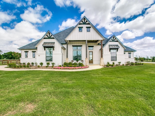 modern inspired farmhouse featuring a front lawn