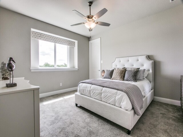 carpeted bedroom with ceiling fan