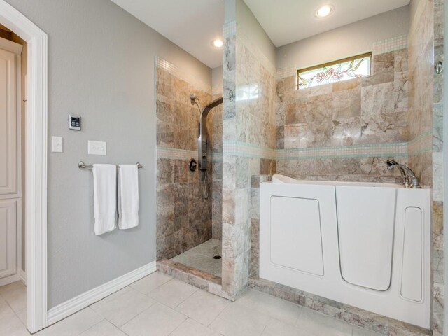 bathroom featuring tile patterned floors and plus walk in shower