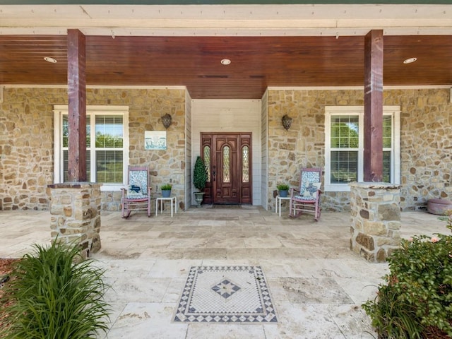 doorway to property featuring a porch