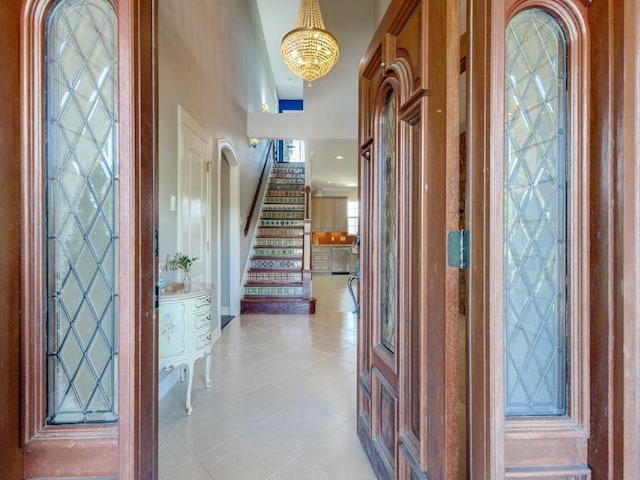 foyer entrance with light tile patterned floors