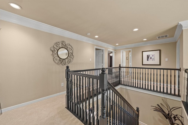 corridor featuring crown molding and light colored carpet