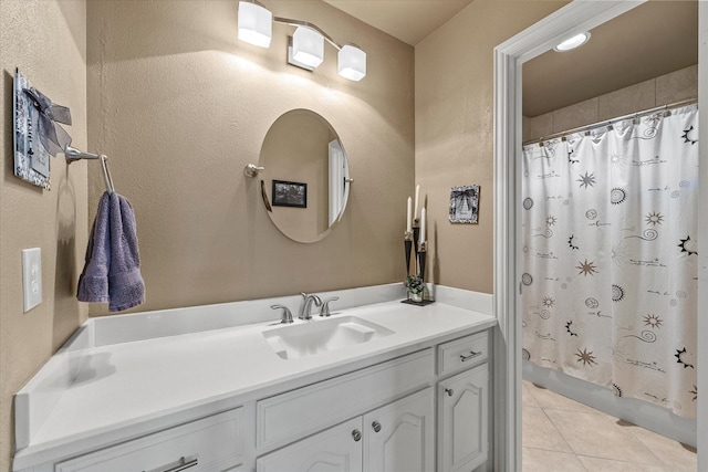 bathroom featuring shower / tub combo with curtain, vanity, and tile patterned flooring