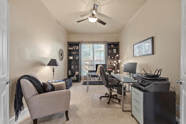 office featuring ceiling fan and light carpet