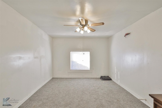 empty room featuring carpet and ceiling fan