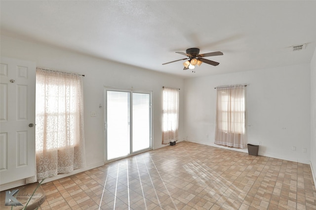 spare room with ceiling fan