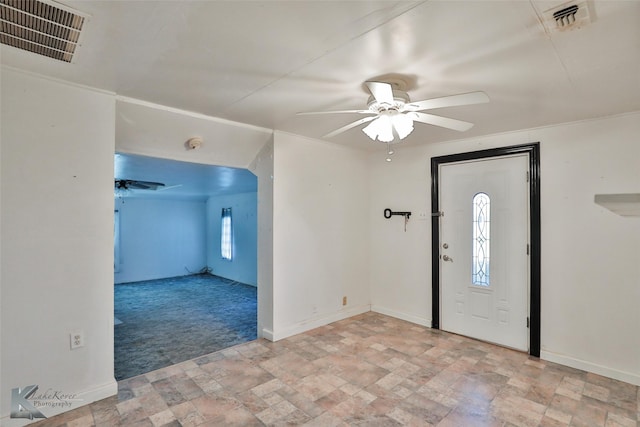 foyer with light carpet and ceiling fan