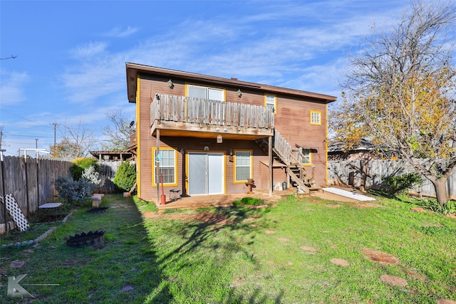 back of house with a lawn