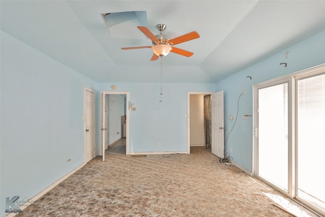 unfurnished bedroom featuring ceiling fan, light carpet, and vaulted ceiling