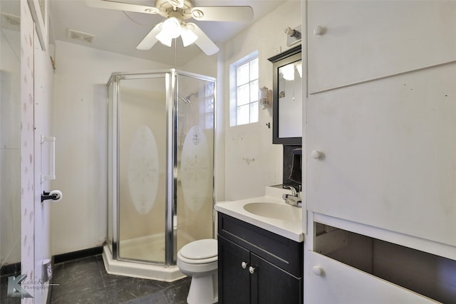 bathroom featuring ceiling fan, tile patterned floors, an enclosed shower, toilet, and vanity