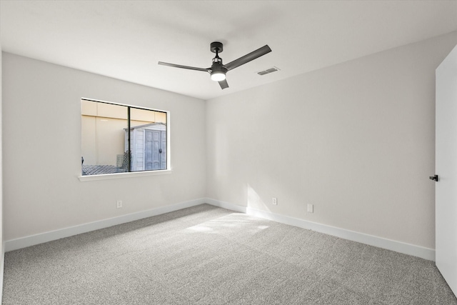 empty room with carpet and ceiling fan