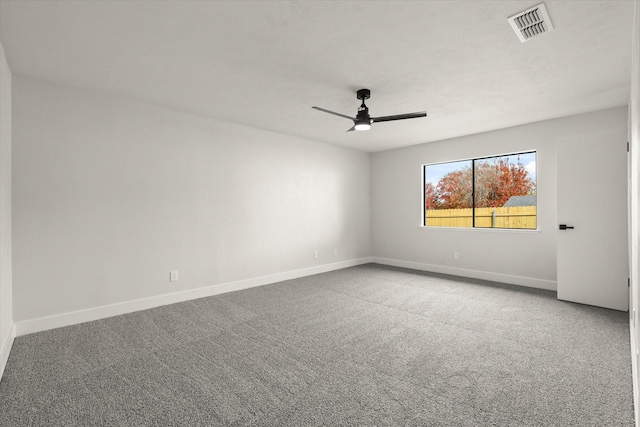 spare room with carpet floors and ceiling fan