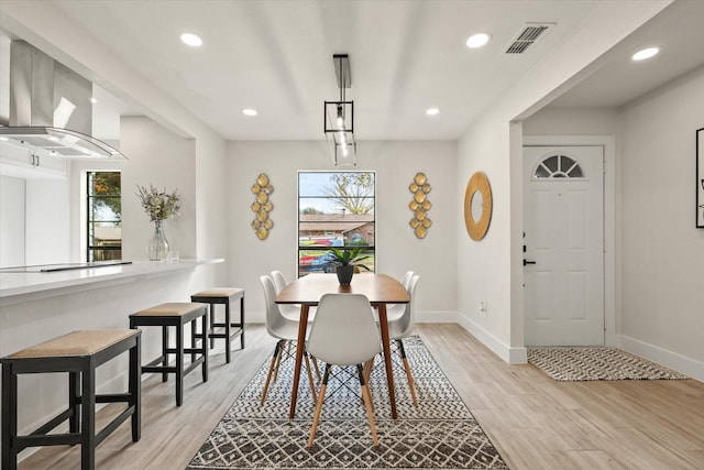 dining space featuring light hardwood / wood-style flooring