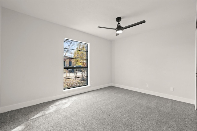 empty room with carpet flooring and ceiling fan