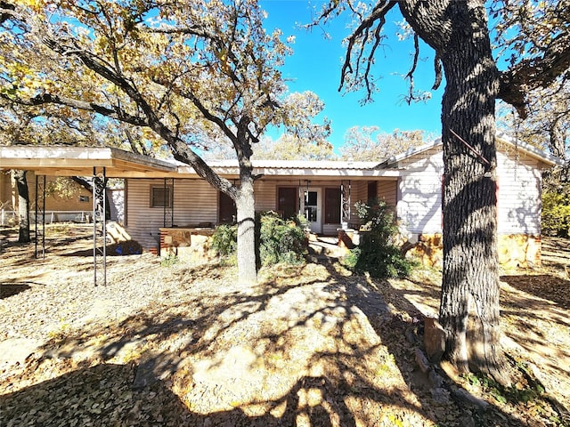 view of front facade with a carport