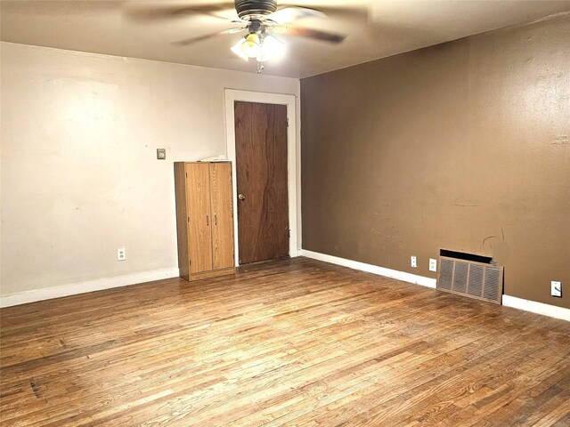 unfurnished room with ceiling fan and light hardwood / wood-style floors