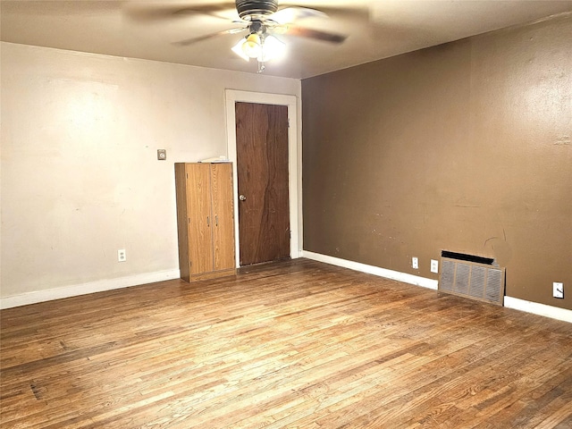 spare room featuring ceiling fan and light wood-type flooring