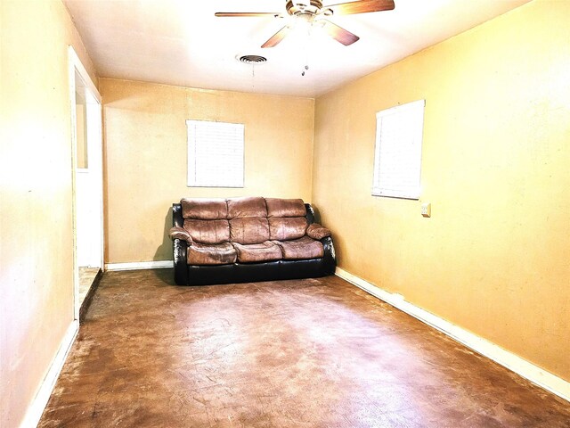 unfurnished living room featuring ceiling fan