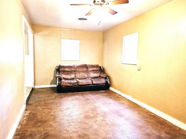 unfurnished living room featuring ceiling fan