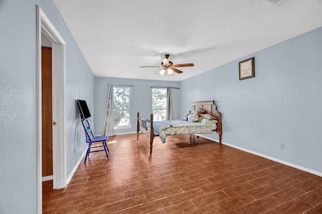 bedroom with hardwood / wood-style flooring and ceiling fan