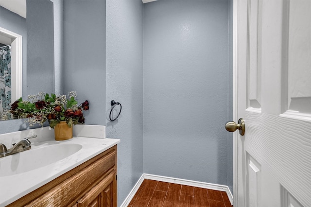 bathroom featuring vanity and hardwood / wood-style flooring