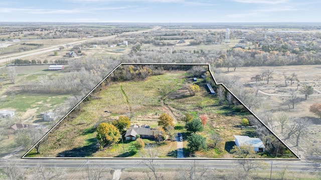 birds eye view of property featuring a rural view