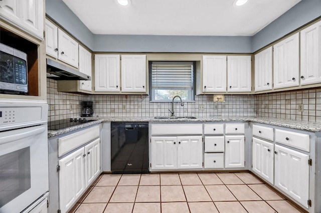 kitchen with black appliances, white cabinets, sink, tasteful backsplash, and light tile patterned flooring