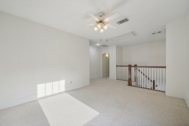 carpeted empty room featuring ceiling fan