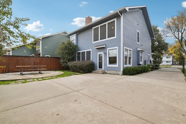 rear view of house featuring a patio