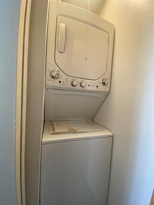 washroom with stacked washer and dryer