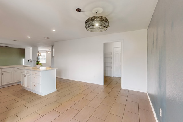 9729 Manassas Rd, Fort Worth, TX 76177 - kitchen with white cabinets, light countertops, a kitchen island, recessed lighting, and open floor plan