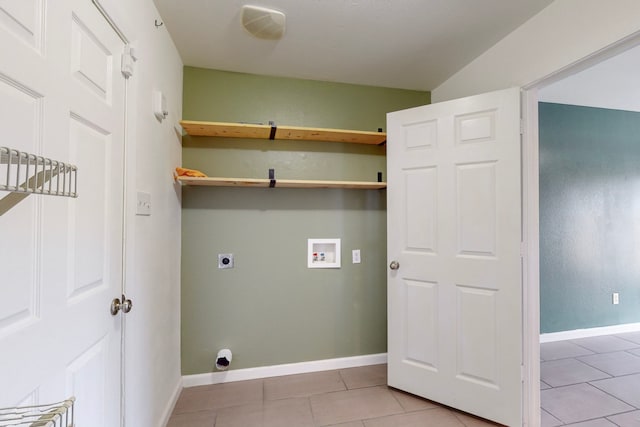 laundry room with electric dryer hookup, light tile patterned floors, and washer hookup