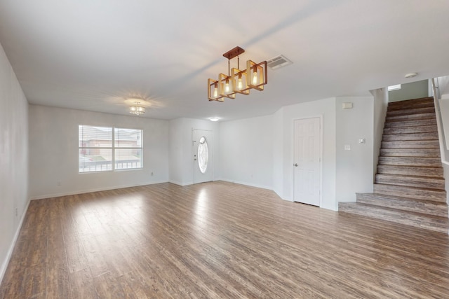 unfurnished living room featuring wood-type flooring