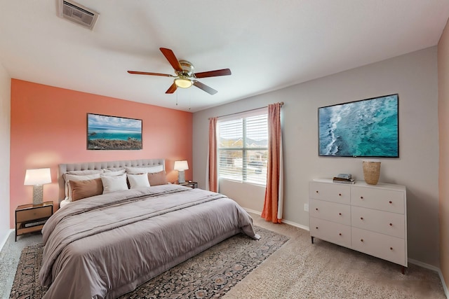 bedroom with light carpet and ceiling fan