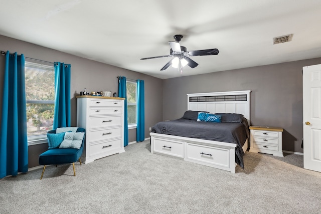 bedroom featuring ceiling fan and light colored carpet