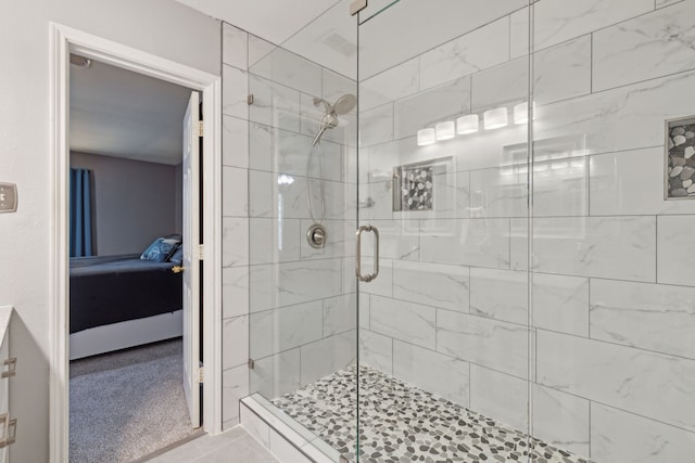 bathroom with a shower with door