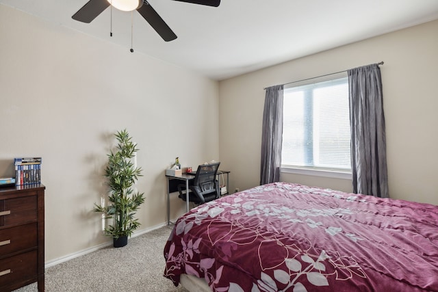 bedroom featuring ceiling fan and light carpet