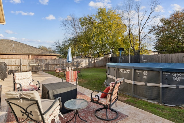 view of patio / terrace with a covered pool