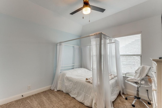 carpeted bedroom featuring ceiling fan and lofted ceiling