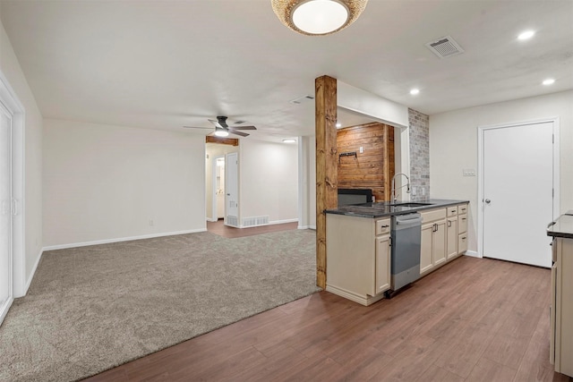 kitchen with sink, dishwasher, ceiling fan, and light hardwood / wood-style flooring