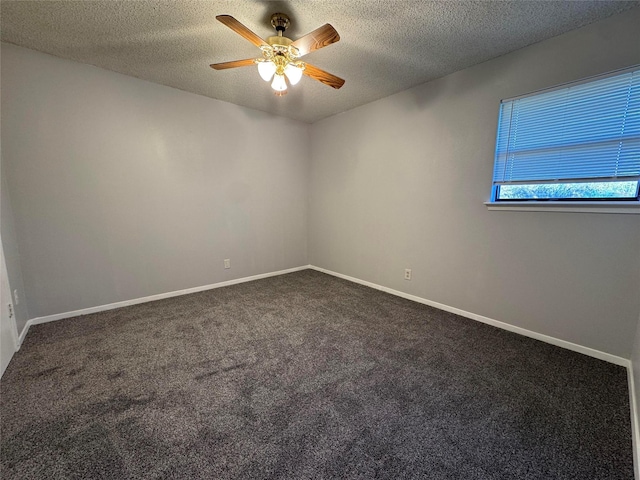 carpeted spare room with ceiling fan and a textured ceiling