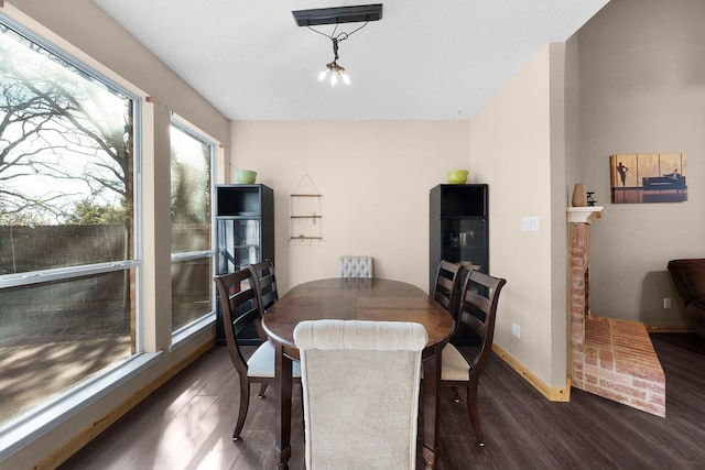 dining space with dark hardwood / wood-style floors