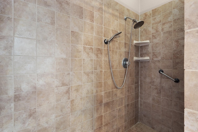 bathroom with a tile shower