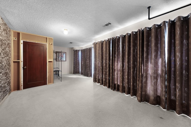 hallway featuring light carpet