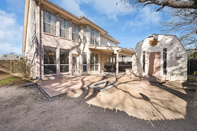 back of house with a patio area