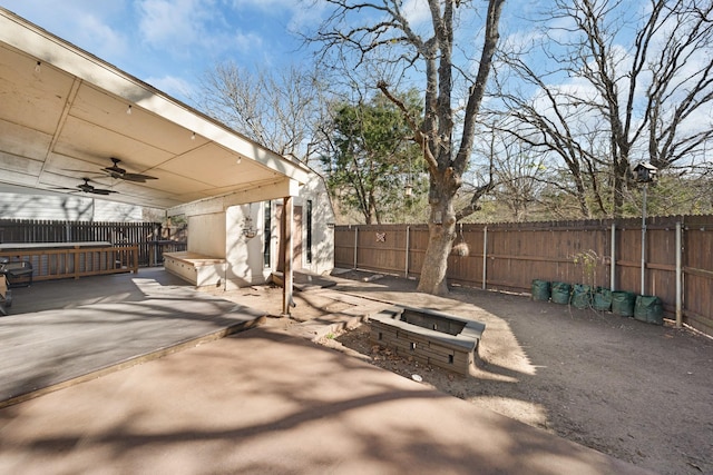 view of patio / terrace featuring an outdoor fire pit and ceiling fan