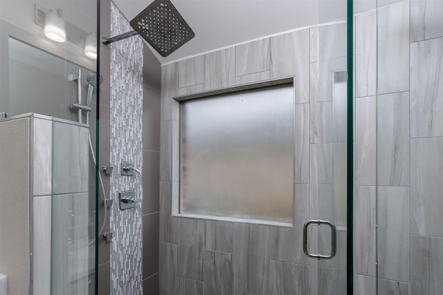 bathroom with a shower with door