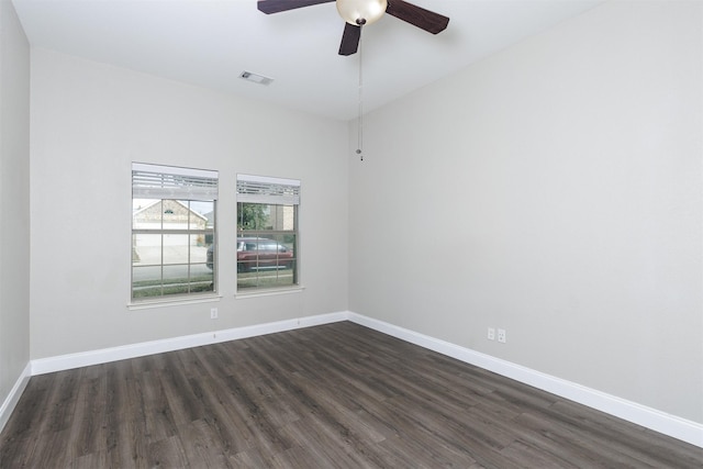 spare room with ceiling fan and dark hardwood / wood-style floors